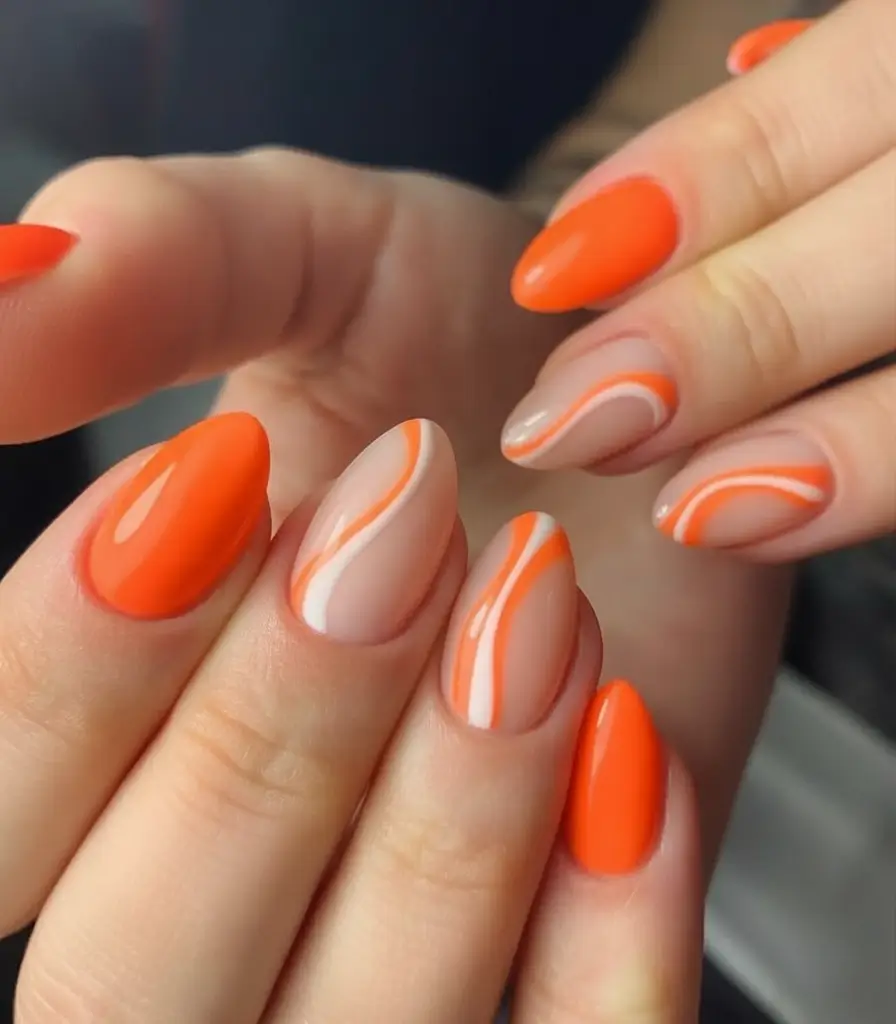 Fall Nail Art Ideas for September 2025 Orange Swirl Almond Tips