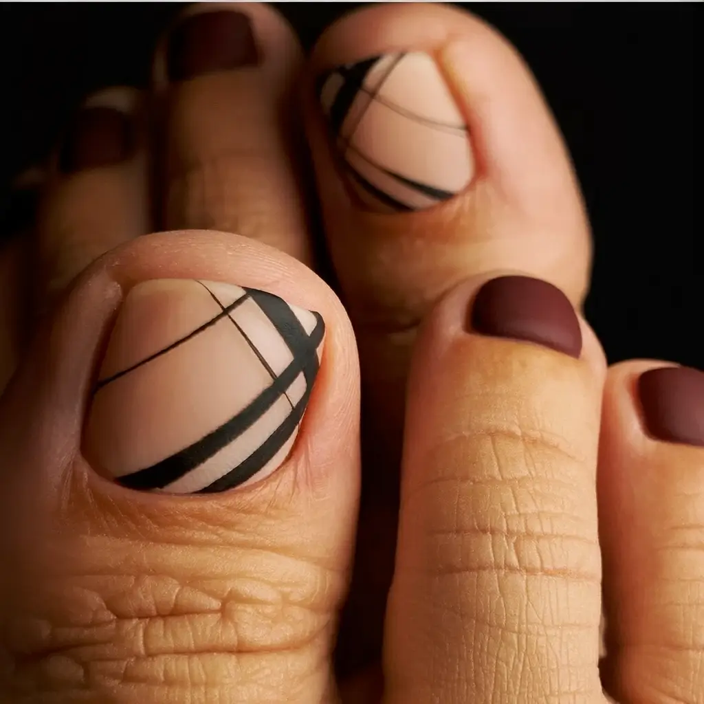 Fall Toe Nail Looks for September 2025 Minimalist matte with graphic black lines