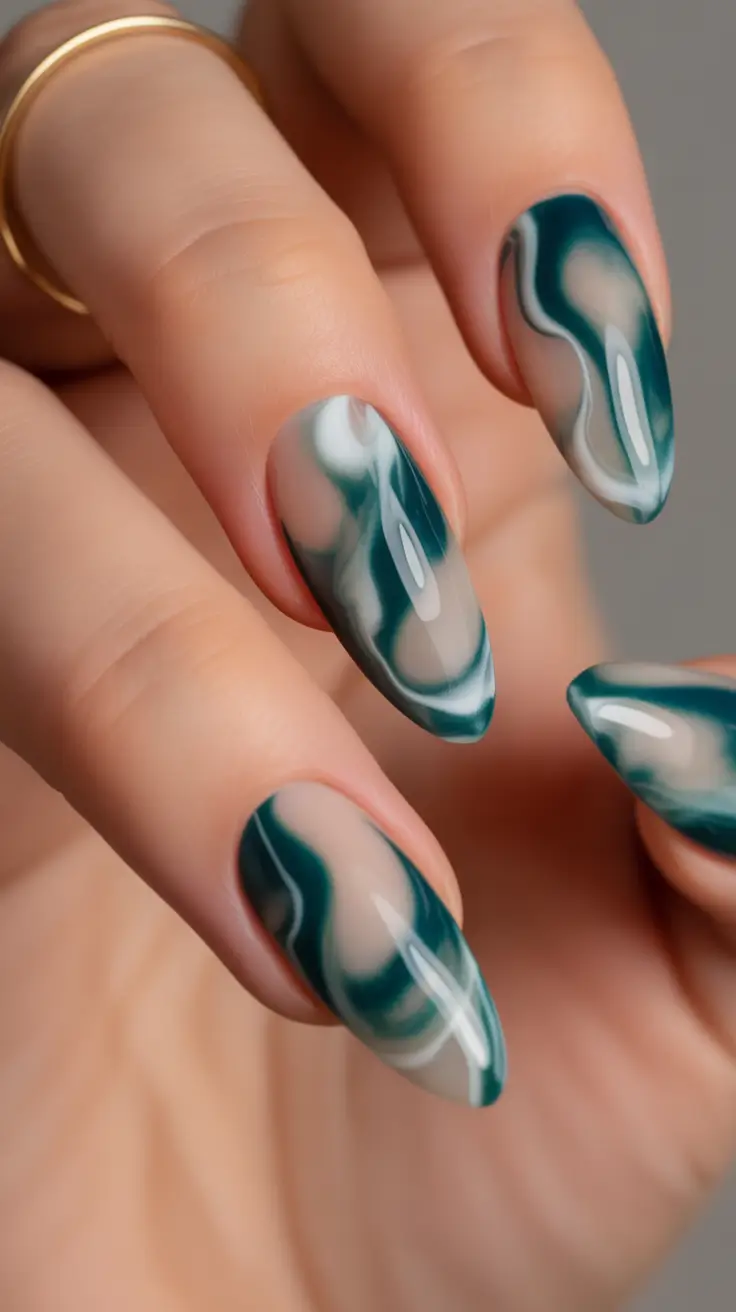 long fall nails trends 2025 Marble Magic in Deep Emerald