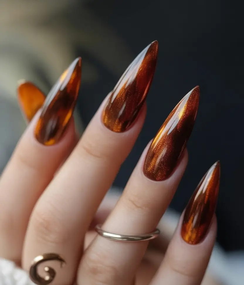 long fall nails trends 2025 Molten Bronze Stilettos