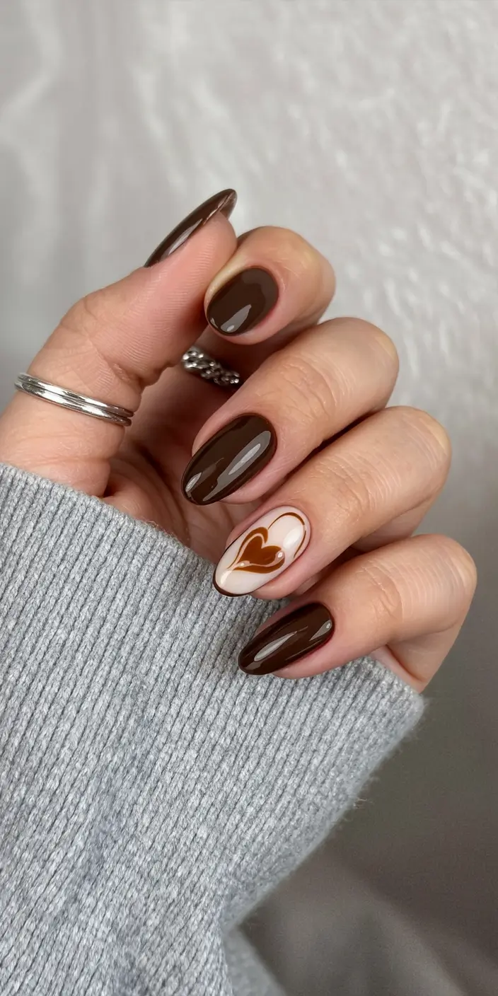 Stylish Brown Fall Nails 2025 – Glossy Cocoa with Heart Accent