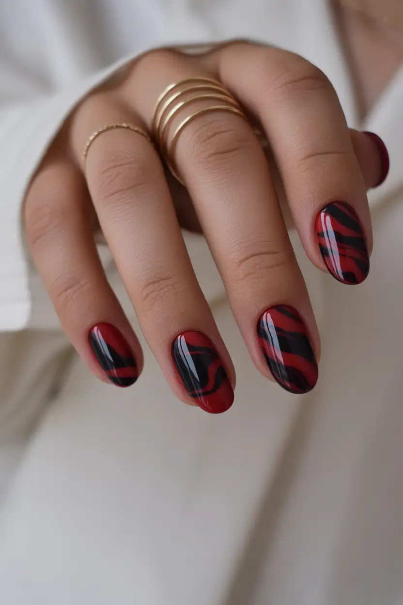 Fall Winter Nail Colors Trends 2025–2026 Red and Black Swirl
