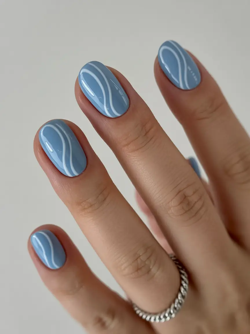 Christmas Nail Color Trends 2025 Frosty Blue Swirls