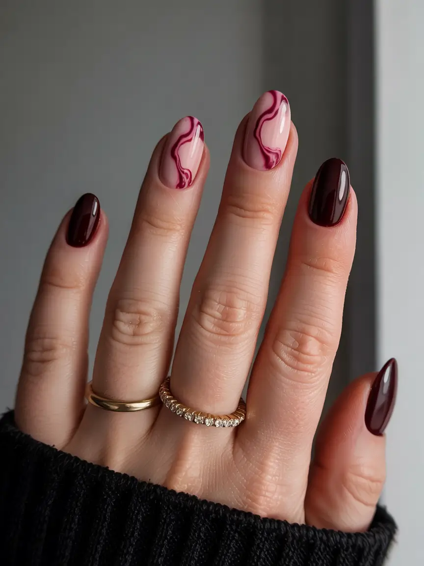Stylish Nail Ideas for Winter 2025–2026 Wine Marble Chic