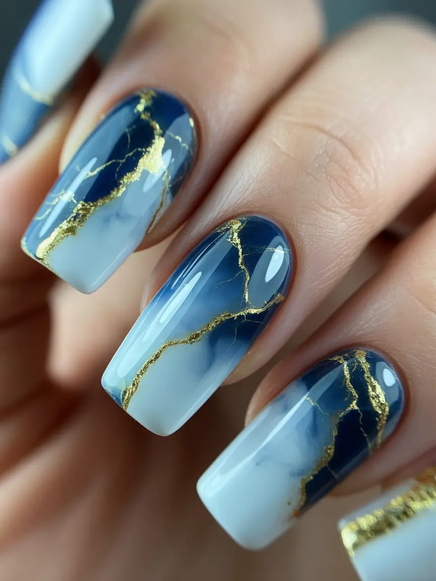 Stylish Nail Ideas for Winter 2025–2026 Royal Blue with Gold Veins