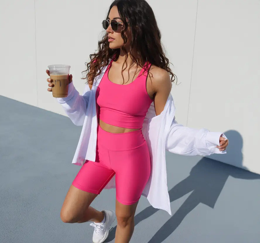 New gym fashion trends 2026 Hot pink shorts set with crisp white shirt
