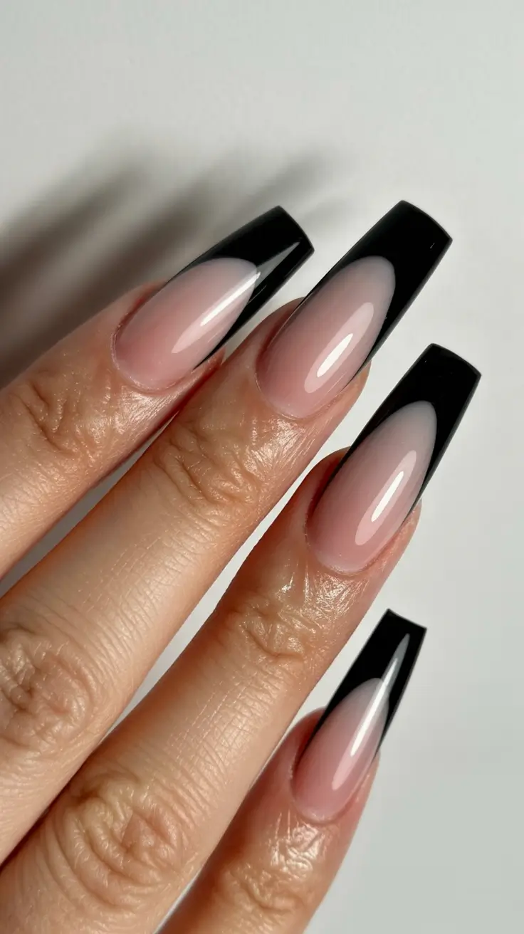 Classic black nails for 2026 Nude base black tips
